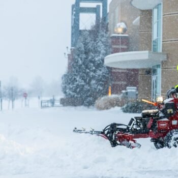 Commercial snow removal crew plowing snow 6